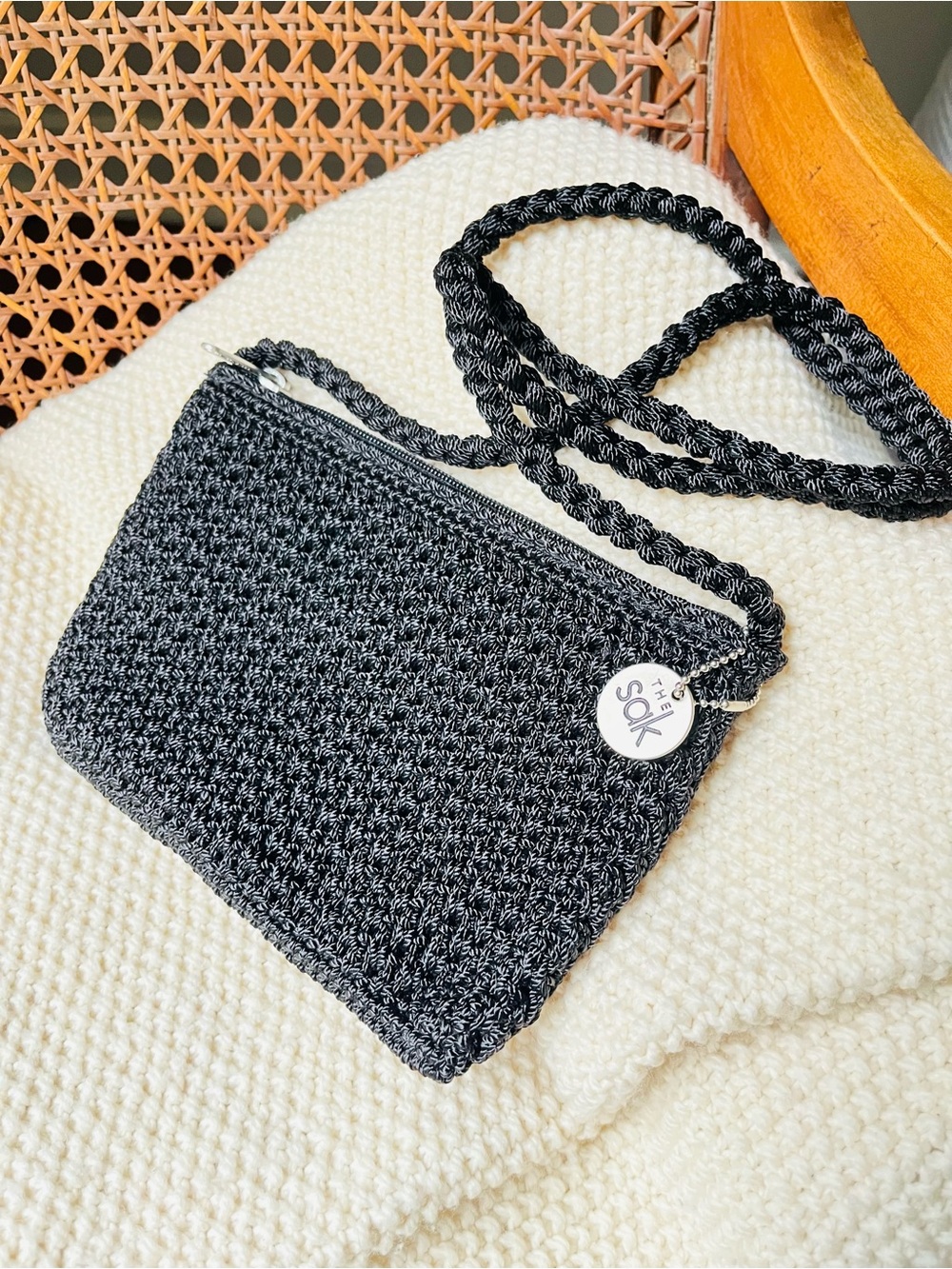 The Sak Black Woven Crossbody Clutch with Braided Strap